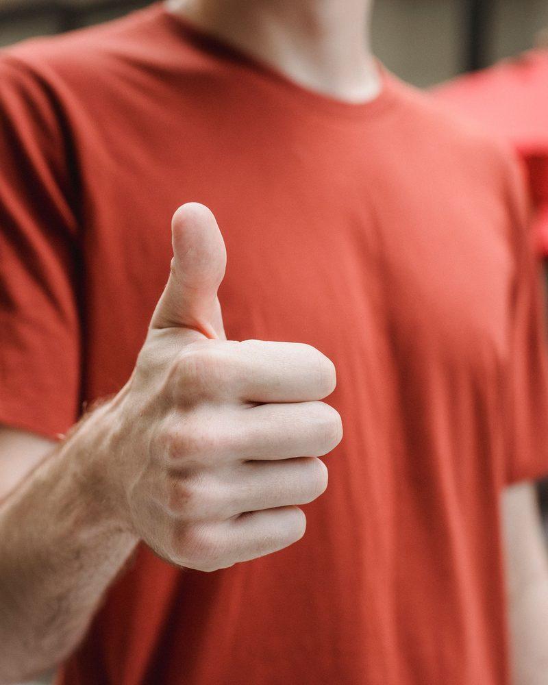 Satisfied customer giving a thumbs up
