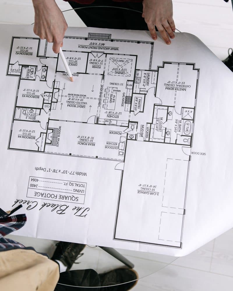 Reviewing house plans together at the table